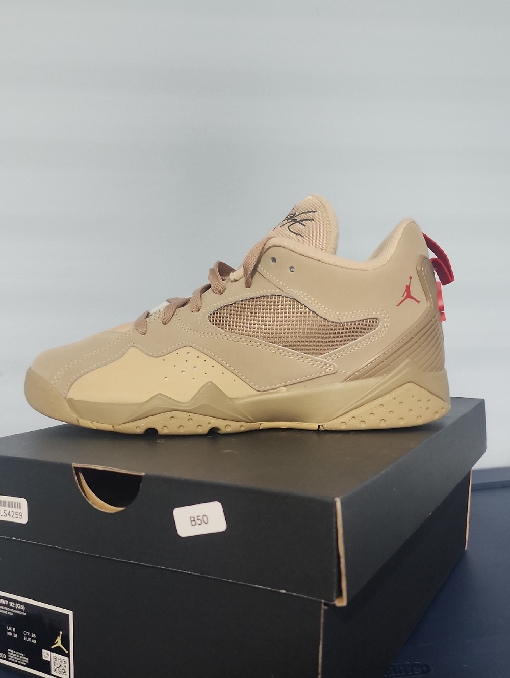 Jordan Men's Tan Low-Top Sneaker with Red Jumpman Accent